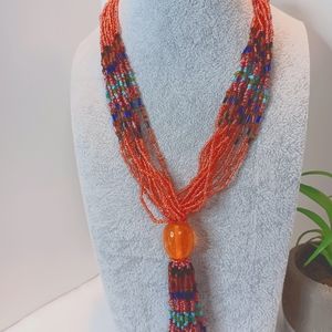 Coral colored beaded necklace